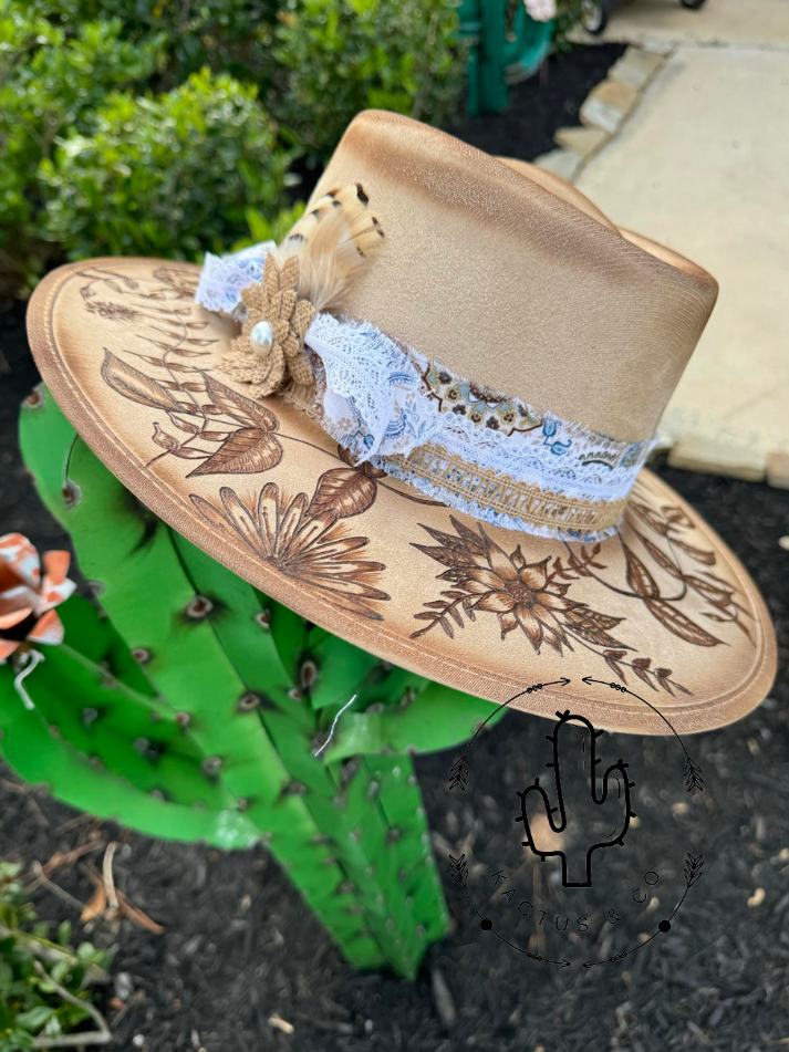 Light brown heavily floral Burned Hat