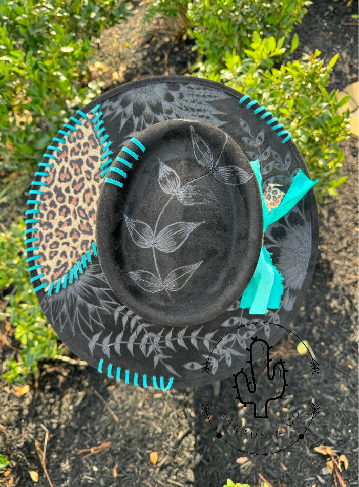 Black leopard with teal stitching Burned Hat